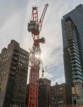 Manhattan construction crane at sunset Stock Photos