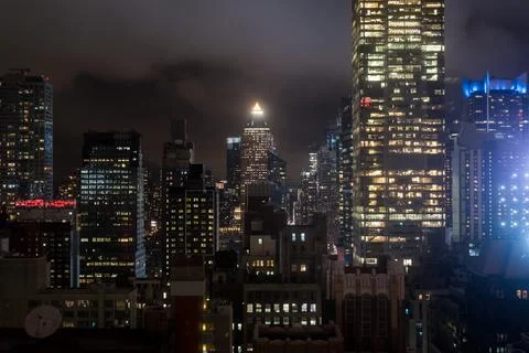 Manhattan interior view from a high floor at night in NYC Stock Photos
