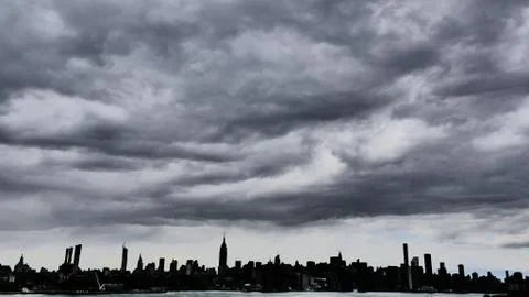 Manhattan landscape under clouds Stock Photos