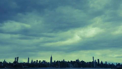 Manhattan landscape under clouds Stock Photos
