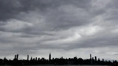 Manhattan landscape under clouds Stock Photos
