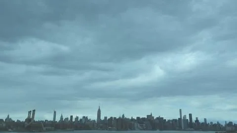 Manhattan landscape under clouds Stock Photos