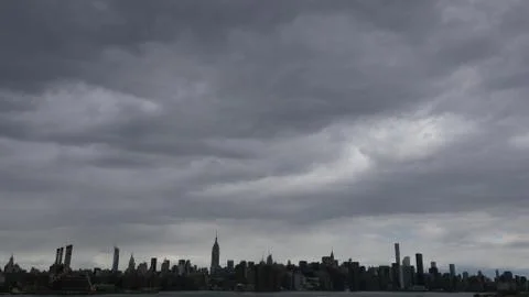 Manhattan landscape under clouds Stock Photos