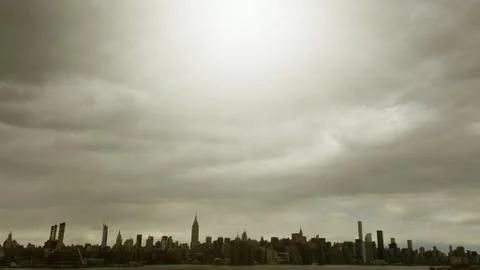 Manhattan landscape under clouds Stock Photos