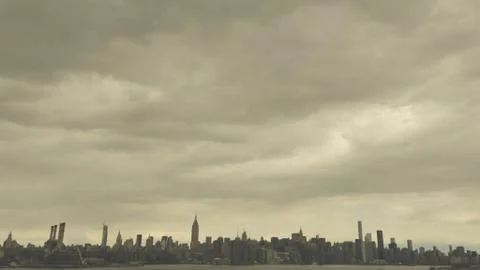 Manhattan landscape under clouds Stock Photos