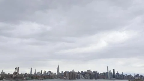 Manhattan landscape under clouds Stock Photos