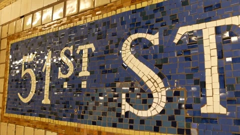 Manhattan Midtown subway platform, 51 street metro. Sign on wall, tile. New York Stock Footage 323680799