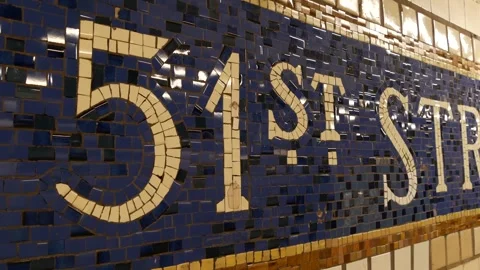 Manhattan Midtown subway platform, 51 street metro. Sign on wall, tile. New Stock Footage 346602462