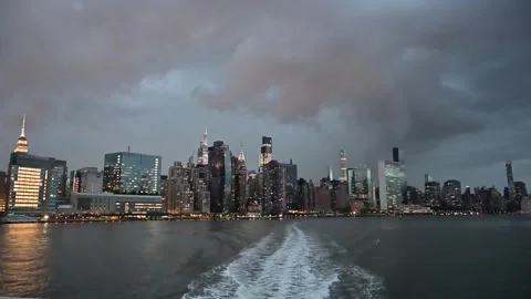 Manhattan at night on the hudson Stock Footage 310657199