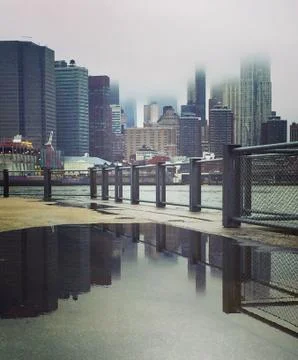 Manhattan reflecting in a puddle Stock Photos