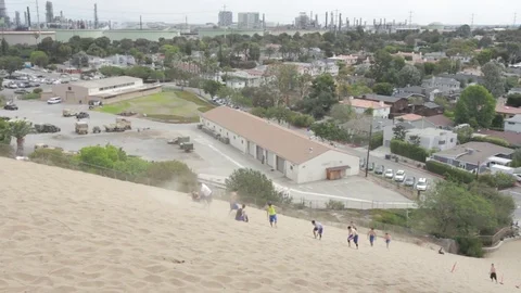 Manhattan Sand Dune run up Los Angeles in background Video stock 81456295