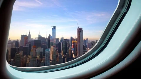 Manhattan seen from a plane's window 4k Stock Footage 82733552