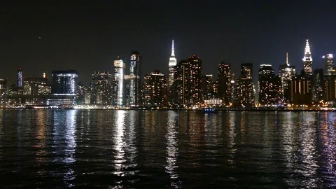 Manhattan Skyline and East River at Night, view from Long Island City, NY Stock Footage