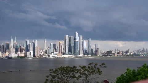Manhattan skyline with dramatic storm clouds Stock Footage 254875351