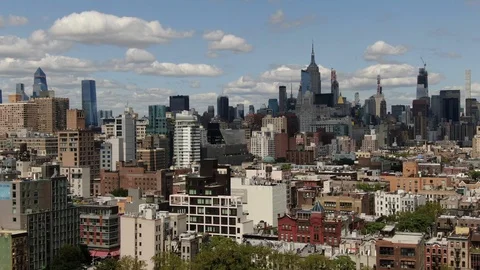 Manhattan Skyline Rising Beyond Lower East Side Rooftops Vídeo Stock 114669742