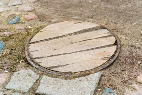Manhole cover composition as a background Stock Photos