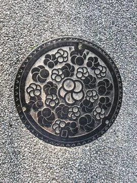 Manhole cover in Dazaifu Tenmangu in Fukuoka, Japan Stock Photos