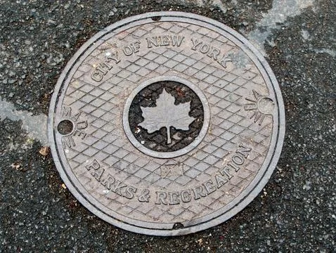 A manhole cover. Stock Photos