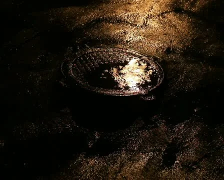 Manhole in the puddle from night rain Stock Footage 10758748