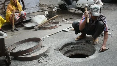 Manhole worker with hammer Stock Footage 170623118