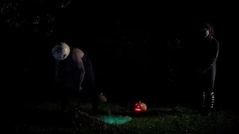 A maniac digs a grave, a monster digs a hole and notices that someone Stock Footage 251820797