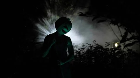 A maniac digs a grave, a monster digs a hole and notices that someone Stock Footage 251821210