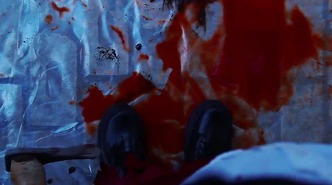 Maniac dropping murder weapon in pool of blood on ground, corpse dissection Stock Footage 59083794