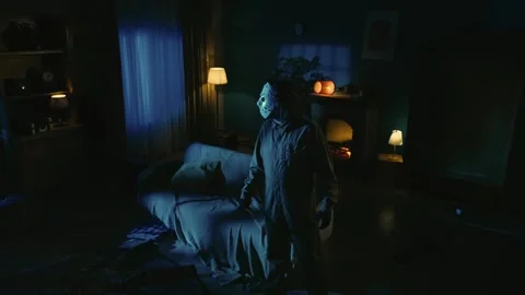 Maniac with knife walking through room, girl comes out from the next door Stock Footage 250419467