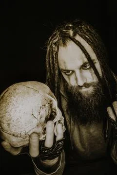 Maniac with skull 스톡 사진