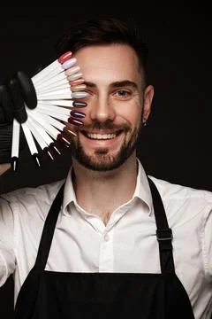 Manicur master man in working form with tools in hand. Nail photo content Stock Photos