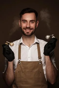 Manicur master man in working form with tools in hand. Nail photo content Stock Photos
