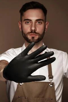 Manicur master man in working form with tools in hand. Nail photo content Stock Photos