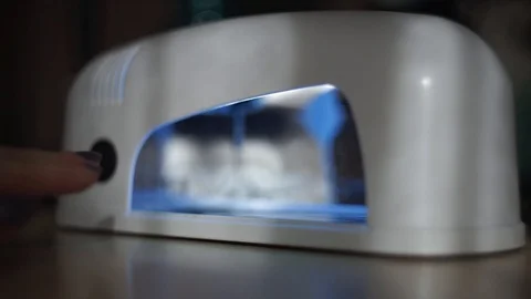 Manicure and put nails to UV lamp Stock Footage 103202342