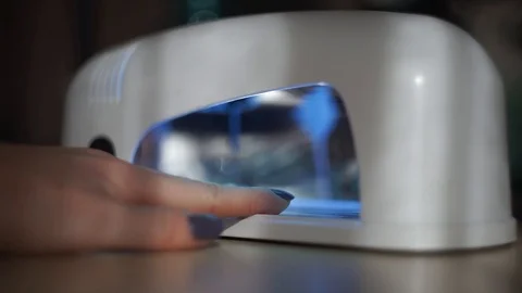 Manicure and put nails to UV lamp Video stock 103202361