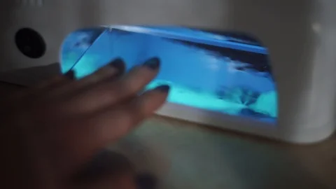 Manicure and put nails to UV lamp Video stock 103202413