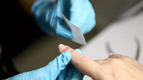 Manicure buffing and filing nails to elder female customer. caucasian 50 years Stock Footage 149439749