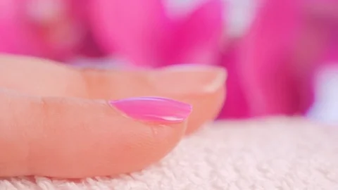 Manicure close up on orchid background Stockbeeldmateriaal 79679930