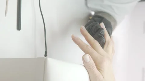 Manicure of female hands, close-up, Master applying transparent varnish to a Stock Footage 305648705