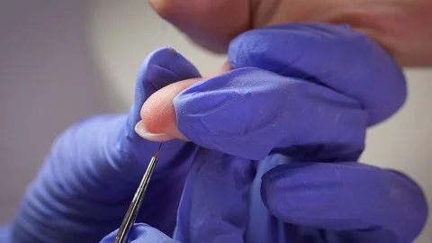 Manicure gel polish first layer red Stock Footage 103830833