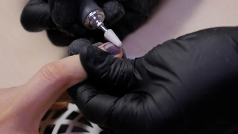 Manicure with the help of a nail polish machine. Stock Footage 120023794
