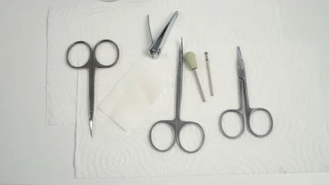 Manicure instruments scissors and cutters on napkin on table prepared to work. Video stock 145317730