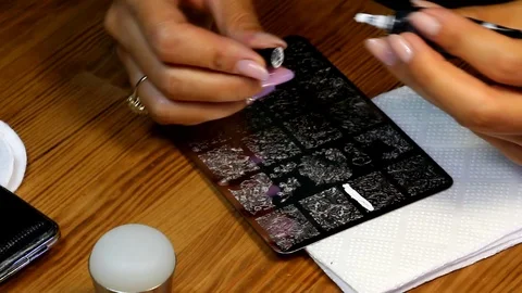 Manicure master apply paste on the workpiece Stock Footage 90868528