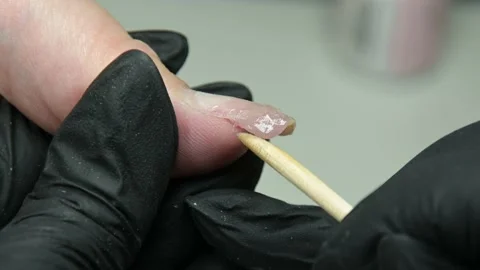 The manicure master creates an artificial nail Stock Footage 205524836