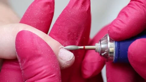 Manicure Master Doing Manicure - Cleans the Cuticle Using Device Stock Footage 130476235