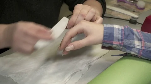 Manicure master filing the gel nails Stock Footage 72365357