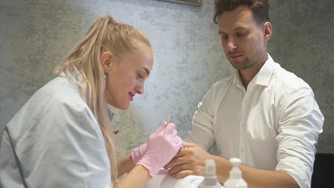 Manicure master making basic manicure on mans hands Stock Footage 114001712