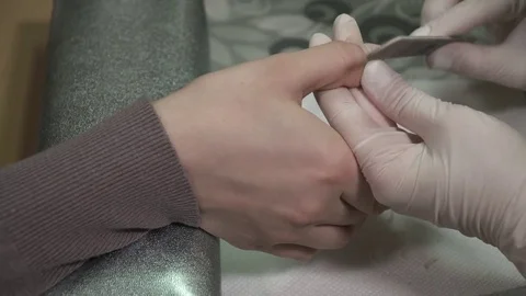 Manicure master making the customer's nails beautiful Stock Footage 73422085