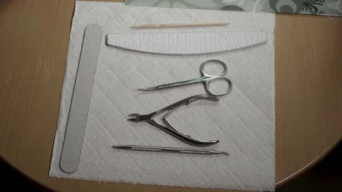 Manicure master preparing different manicure tools Stock Footage 73416443