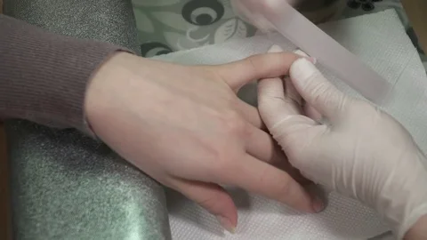 Manicure master working with the nail file Stock Footage 73422739