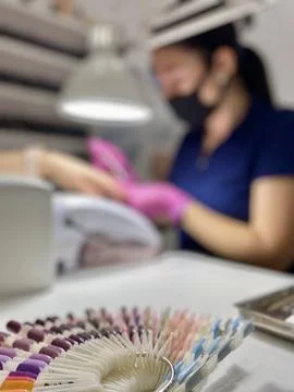 Manicure master working process in beauty studio Stock Photos